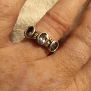 Tanzanite oval stones with diamond chips set in a sterling silver thick band 7